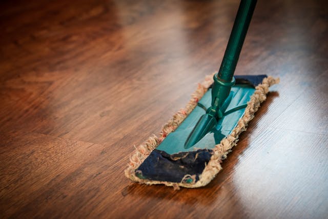 Mopping the floor of a rental home